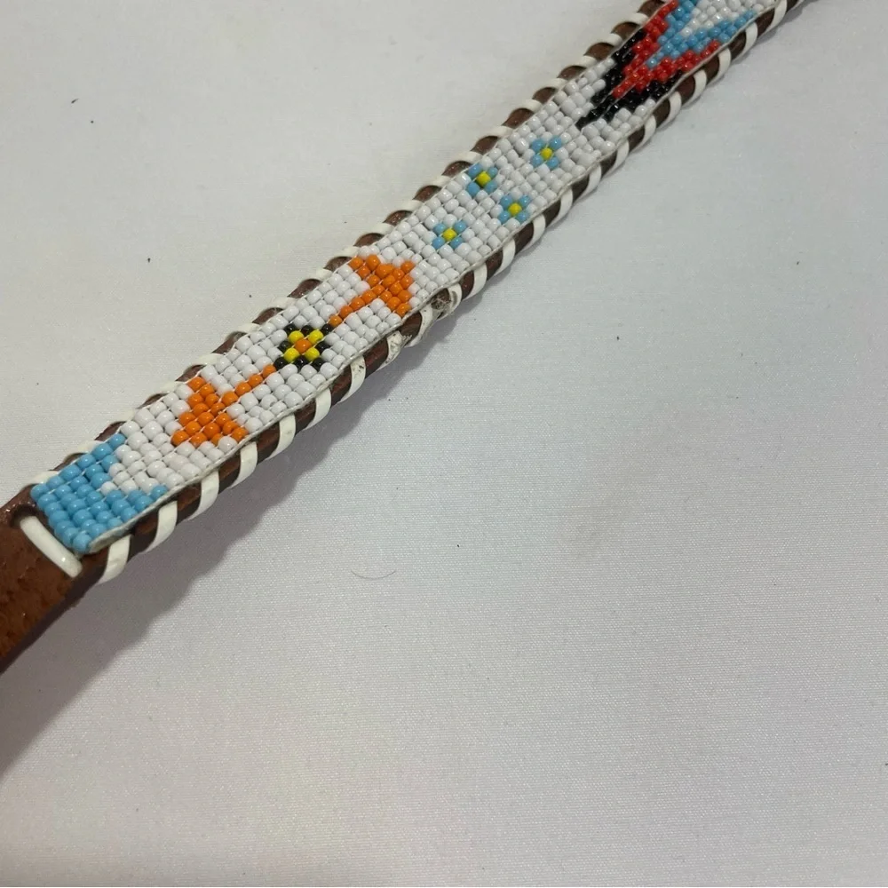 Child’s brown tribal beaded belt. Braided edge. Size 28. Pre-owned. Eagle. Arrow